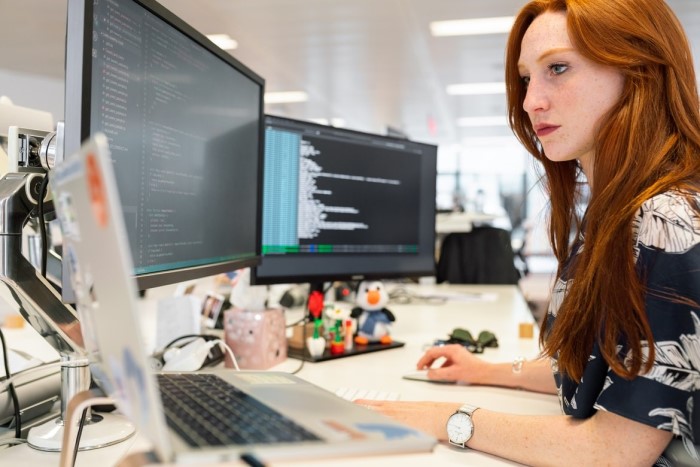 Small team of developers working at the same table